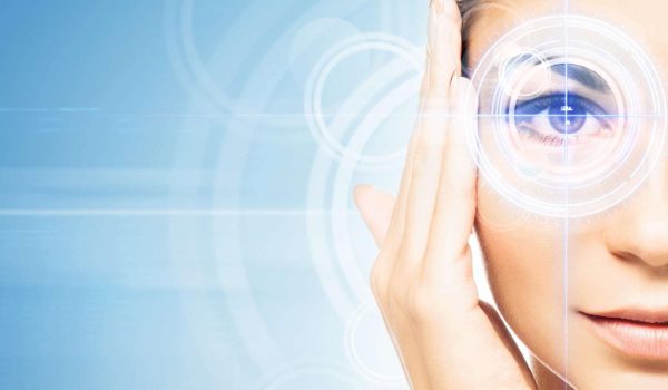 Close-up portrait of young and beautiful woman with the virtual hologram on her eyes (laser medicine and security technology concept)